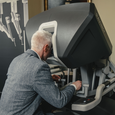 Someone practising with a surgical robot